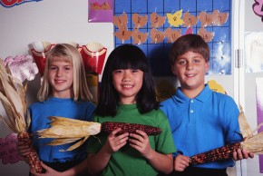 Kids holding corn
