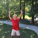 Kid playing golf