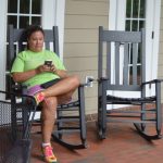 woman rocking on front porch
